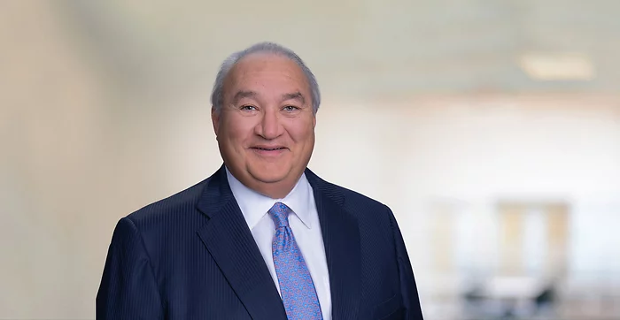 Blurry Champange Background with Blue Square NH Logo